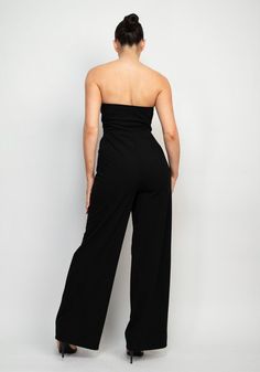 Strapless Wide Leg Jumpsuit Brand: Haute Monde Style: HMP40786 Fabric: 94% POLYESTER, 6% SPANDEX Details: A knit global sleek trend tube jumpsuit in solid color featuring wide leg, princess seams, side pockets, and full-length. Made in Cambodia Solid Color Strapless Stretch Jumpsuit With Wide Leg, Stretch Strapless Jumpsuit With Wide Legs, Chic Strapless Maxi Jumpsuit For Evening, Solid Color Strapless Wide Leg Jumpsuit For Party, Evening Stretch Strapless Jumpsuits And Rompers, Solid Wide Leg Jumpsuits And Rompers For Evening, Wide Leg Jumpsuits And Rompers For Evening, Chic High Waist Strapless Jumpsuit, Solid Color Wide Leg Jumpsuits For Evening