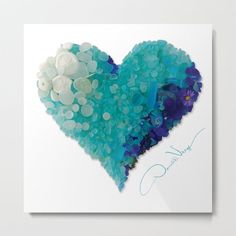 a heart shaped painting with blue and white flowers