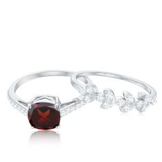 Product Details Embrace perfection with this stunning Cushion Cut Garnet Ring Set. The Garnet is securely held in a Claw Setting, accompanied by sparkling Diamond Side Stones. The leaf-inspired band on the Ring Set adds a touch of elegance, making this ring truly perfect for any occasion. Product Information SKU SHP-RINGS032227481 Weight 3.84 gm (Approximate) GARNET INFORMATION No.of Stones 1 Pieces Total Weight 1.35 Carat (Approximate) Dimension(approx) Cushion-6X6 mm-1 Pcs Color Red Cut Brilliant Shape Cushion Setting Type Prong-Setting Quality Grade AAA DIAMOND INFORMATION No.of Stones 31 Pieces Total Weight 0.37 Carat (Approximate) Dimension(approx) Round-1.20X1.20 mm-21 PcsRound-1.30X1.30 mm-10 Pcs Color HI Cut Brilliant Shape Round Setting Type Prong-Setting Quality Grade SI View Mor Garnet Ring With Diamond Accents, Elegant Garnet Stackable Rings, Garnet Brilliant Cut Ring, Brilliant Cut Garnet Jewelry For Wedding, Formal Stackable Rings With Accent Stones, Stackable Ring Sets, Claw Setting, Sparkling Diamond, Garnet Ring