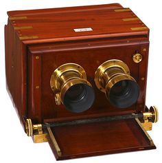 an old fashioned wooden box with two binoculars