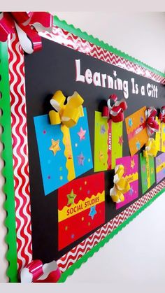 a bulletin board with colorful paper and bows on it's sides that says learning is a gift