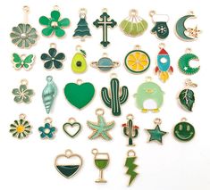 many different types of brooches are shown in various colors and shapes on a white surface