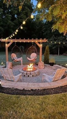 an outdoor fire pit surrounded by lawn furniture and string lights in the evening time,