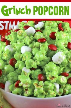 a bowl full of green popcorn with candy on top and the title overlay reads, grin pop corn