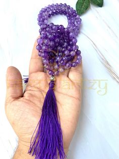 Hare Krishna ✅With the Brand Name NAMYA ARTZY✅ 🌱Beautiful Natural 8mm Amethyst Stones Japa mala | Necklace | Prayer Beads Mala🌱 ❣️You never see this unbreakable quality of closing knots.  ✅This beautiful Amethyst Stone bead mala is hand-knotted on a bright & and Shine Purple Colour thread to add longevity and comfort during meditation and finished with a Shining German Silver guru bead and a matching Contrast Purple Colour silk tassel.✅ 🌺108 Beautiful Amethyst Stones 🌿8mm Hand-knotted Japa Mala with Stylish Knotted Finishing with Wax/Parachute Thread to add longevity & and comfort during meditation with Unbreakable Quality. Finished With ❤️ German Silver Guru Bead❤️ and with a new finishing, closing knots design. Best product to give someone as a spiritual Gift purpose. ASSURING FOR BE Purple Beaded Necklaces For Healing With Round Beads, Handmade Amethyst Beaded Necklaces With Round Beads, Adjustable Crystal Necklaces With 8mm Beads For Gifts, Round 8mm Beads Crystal Necklace Gift, Purple Beaded Necklaces With 8mm Beads As Gift, Purple Beaded Necklaces With 8mm Beads For Gifts, Amethyst Beaded Necklaces With Round Beads For Gifts, Purple Beaded Necklace With 8mm Beads As Gift, Spiritual Purple Beaded Necklaces For Gifts