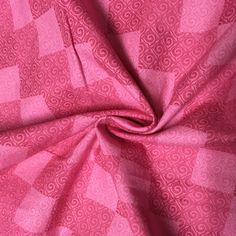 a pink fabric with an intricate design on it