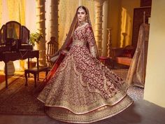 Gold & Red Bridal Dress Pakistani In Lehenga Gown Style Bridal Dress Pakistani, Maroon Anarkali, Pakistani Gown, Pakistani Bridal Lehenga, Bridal Mehndi Dresses, Pakistani Bridal Dress, Dress Pakistani, Red Bridal Dress, Lehenga Gown