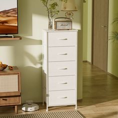 a white chest of drawers in a living room