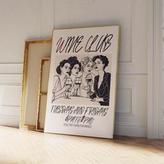 a framed poster on the floor in front of a wall with an advertisement for some club