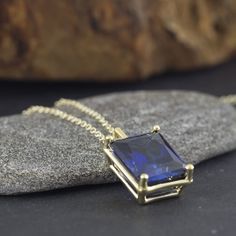 An Elegant and simply stunning gold Sapphire necklace. This handmade piece of jewelry is set with a 10x12 Sapphire corrndum (6.51ct minimum) in the deepest and most beautiful blue. The setting itself is vintage inspired in its simplicity and holds the stone securely whilst allowing for maximum light to enter the stone. Hangs from a strong yet dainty vintage inspired oval link chain. Making & Shipping of this piece: Each item is made to order, please allow 4-7 days in normal times and 5-11 da Sapphire Diamond Cut Pendant Necklaces, Sapphire Tanzanite Birthstone Necklaces, Sapphire Necklace With Diamond Cut As Gift, Sapphire Necklace With Diamond Cut For Gift, Diamond Cut Sapphire Necklace For Gift, Classic Sapphire Pendant Necklace, Sapphire Diamond Cut Necklace For Gift, Gold Sapphire Necklace For Formal Occasions, Formal Gold Sapphire Necklace