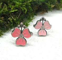 "Summer jewelry, gift for girlfriend or big sister - Pink enamel flower rings in size 7 and 8. Vintage Silver plated boho rings, cute enamel cocktail rings with pink flowers. The rings are shaped like 3 petal flowers with a clear rhinestone in the middle and pink enamel petals. The ring is made of silver plated copper alloy and has a manufacturer's stamp on the back side. The flower measures 16 mm across. I have only 2 rings, one is light pink color and size 7. The other is brighter pink color a Pink Enamel Jewelry With Flower Charm, Pink Enamel Flower-shaped Jewelry, Enamel Jewelry For Spring Gifts, Pink Enamel Ring For Wedding, Spring Enamel Jewelry As Gift, Spring Enamel Jewelry For Gifts, Spring Gift Enamel Jewelry, Pink Enamel Rings For Gift, Cute Flower Jewelry For Valentine's Day