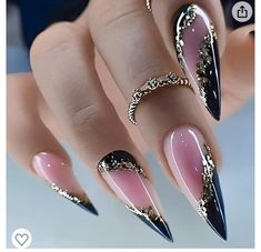 a woman's hand with black and pink stiled nails