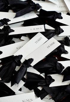 black and white tags with names on them