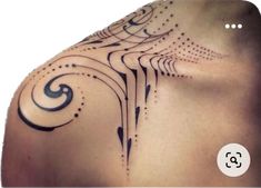 the back of a woman's shoulder with an intricate design on it