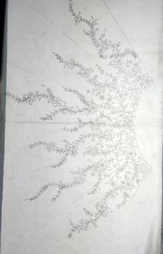 an image of a drawing on paper with lines and flowers in the shape of a circle