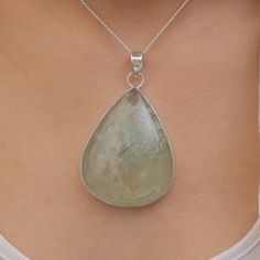 Prehnite Pendant - 925 Sterling Silver Necklace - Crystal Pendant - Women Silver Jewelry - Natural Gemstone Pendant - Birthday Gift   Gemstone Name -  Prehnite Gemstone . Stone Quality - AAA. Weight -  46.2 g  Length  - 7.5 cm Width -  4.4 cm Stone Shape - as Shown In The Picture. The Height of the pendant including the loop is 7.5 cm 18 inch Chain - The total length of the chain is 18 inch including a 2-inch adjustable chain. So you can adjust the chain from 16 inches to 18 inches. You adjust t Silver Gemstone Necklace For Birthday, Silver Necklace With Gemstone For Birthday, Silver Gemstone Jewelry For Birthday, Sterling Silver Teardrop Birthday Necklaces, Sterling Silver Teardrop Necklace For Birthdays, Sterling Silver Teardrop Necklace For Birthday, Silver May Birthstone Gemstones For Gifts, Sterling Silver Drop Gemstones Gift, Silver Gemstones For May Birthstone Gift