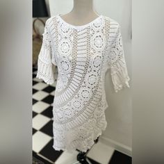 This Gorgeous & Flattering Hand-Crochet Asymmetrical Unlined Tunic/Dress In 100% Cotton In Pure White Is Perfect To Coverup On The Beach Or Wear W A Tank & Leggings Or Skirt Underneath! This Dress Comes In One Size Chest 44” Armhole 22” Sleeve Length 12” Shorter Side (From Shoulder To Hem) 23” Longer Side (From Shoulder To Hem) 42” White Open Knit Lace Crochet Dress, White Lace Crochet Dress With Open Knit, Summer Crochet Dress With Crochet Trim For Brunch, Lace Crochet Dress With Crochet Trim For Brunch, Chic Crochet Dress With Crochet Trim For Brunch, Bohemian Crochet Lace Dress For Brunch, Chic Crochet Dress For Brunch, Short Sleeve Crochet Dress With Lace Trim For Beach, Beach Crochet Dress With Lace Trim And Short Sleeves