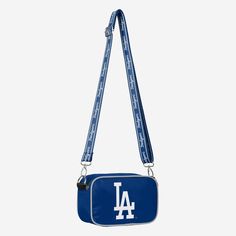 At the game. In the crowd. On the go. Youĺve got team spirit in the bag (along with the rest of your stuff) with this Los Angeles Dodgers Team Stripe Crossbody Bag. Features All-over team-colored design that makes carrying your stuff to the game a breeze Bold team logo display, in case there were any doubts where your allegiances lie Woven, team-colored crossbody strap that makes carrying the team easy and convenient Repeat script team name display on strap for a little extra team spirit Full-zi Logo Display, In The Bag, Los Angeles Dodgers, Team Names, Team Spirit, Team Colors, Crossbody Strap, Team Logo, The Game