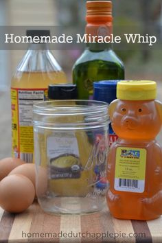 ingredients for homemade miracle whip sitting on a table with eggs and honey in the background