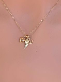 14k solid gold Angle wing , paw print & heart necklace. The best gift for Pet lover necklace . All components onto 14k solid gold . it consists of .. -14k Solid Gold 9.6 x 8.2mm Anchor Charm, 14.5 x 5.3mm Angle wing charm and 11.3 x 6.3mm Heart are attached onto -14k Solid yellow gold baby Box chain or Cable chain or Rope chain , -Come up with beautiful jewelry gift box and -One set of Care instruction package . MORE Solid GOLD JEWELRY https://www.etsy.com/shop/rainbowearring1/items?section_ Gold Jewelry With Heart Charm For Best Friend, Gold Heart Charm Jewelry For Best Friend Gift, Heart Pendant Jewelry Charms For Best Friend Gift, Gold Heart Pendant Jewelry For Best Friend, Heart-shaped Charms Jewelry For Best Friend Gift, Nautical Anchor Shaped Gold Jewelry, Elegant Wing-shaped Yellow Gold Necklace, Angel Wing Necklace Gold, Elegant Yellow Gold Anchor-shaped Necklaces