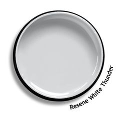 an empty white plate with black rim