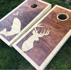 two cornhole game boards with deer silhouettes on them