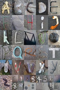 various letters and numbers made out of metal parts on the ground, including one letter