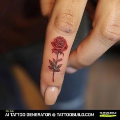 a woman's finger with a rose tattoo on it