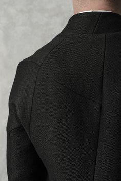 "Deconstructed Black Wool Jacket with Horn Buttons and Raw Hem __One Button Closure __Horn Buttons __Arm-Shaped Deconstructed Sleeves __Two Front Pockets __Fully Lined model__ chest 98 (38\"), waist 77 (30.3\"), hips 92 (36\"), biceps 32 ( 12,6''), height 175 (5'8\"), kg 65 (143 lbs) model wears size S | color: black fabric__ 100 wool, lining: 100 cotton care__ dry clean sizing__ size XS (IT 44, US 34, JP 1) chest 92 - 95 cm / 36\" - 37.4\" waist 74 cm / 29.1\" hips 92 cm / 36\" biceps 30 cm / 1 Black Tailoring Blazer With Concealed Placket, Black Tailored Blazer With Concealed Placket, Black Blazer With Concealed Placket For Tailoring, Black Sport Coat With Button Closure, Black Sport Coat With Concealed Placket, Black Tailored Blazer With Button Closure, Tailored Black Sport Coat With Buttons, Black Sport Coat With Lapel Collar And Buttons, Winter Trousers