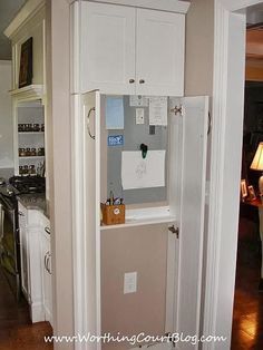 an open refrigerator in the corner of a kitchen