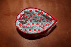 This super cute zippered pouch is a great little bag to fit your items in! This bag opens wide making it great for cosmetics, feminine products, keys, cell phone, first aid supplies or toiletries. This could fit in your purse, diaper bag, or suit case when traveling! This pouch is a pretty turquoise and red rose print with a matching red and turquoise polka dot. This bag is lined with a medium weight interfacing and a fusible fleece, keeping it soft but sturdy for all your things! The zipper kee Red Cosmetic Bag With Zipper Closure - Gift, Feminine Products, Fusible Fleece, Red And Turquoise, Woodland Animal Nursery, Turquoise Rose, Animal Nursery Decor, First Aid Supplies, Zippered Pouch