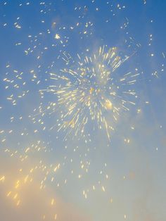 fireworks exploding in the sky on a sunny day