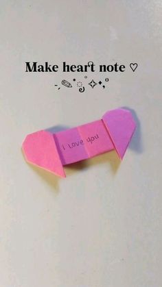 a piece of pink paper with the words make heart note written on it