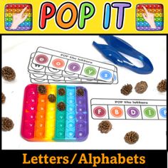 the letters and numbers are in different colors with scissors, pine cones, and paper clips