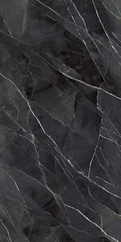 a black marble textured surface with white lines on the top and bottom, as well as dark grey veining