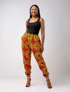 Your Adeola baggy pants are roomy and comfortably stylish, with a gorgeous bright and colorful ankara fabric, it features a high waist line with an elastic band to provide a flex fit and two side pockets to ensure a comfortable wear. The leg openings also feature elastic bands which allow you to adjust how loose or fitted they sit on your calves. Perfect for adding a vibrant pop of color to your look.  Description - 100 % Cotton African Print Wax  - Baggy pants  - Elastic fit around waist - Side Trendy High-waisted Harem Pants With Elastic Waistband, Casual Multicolor Harem Pants With Elastic Waistband, Trendy Baggy Harem Pants With Elastic Waistband, Trendy Straight Harem Pants With Loose Fit, Multicolor Elastic Waistband Sweatpants For Summer, Multicolor Summer Sweatpants With Elastic Waistband, Yellow Harem Pants With Pockets, Baggy Multicolor Pants With Elastic Waistband, Multicolor Baggy Pants With Elastic Waistband