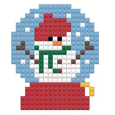 a lego christmas ornament made out of blue, red and white bricks with the face of santa claus