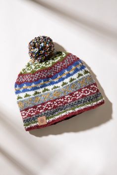 This nordic pom pom beanie is cozy, and the fleece lining makes it comfortable. Whether you are snowboarding, snowshoeing, cross country skiing, or just exploring the world this wool beanie will keep you warm in style. Check out our matching Nordic Wool Mittens to make a perfect pair, look no further for the perfect gift! Year 9, Wool Mittens, Wool Clothing, Grey Beanie, Exploring The World, Cross Country Skiing, Wool Beanie, Snow Shoes, Pom Beanie