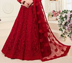 COLOR : Ruby Red FABRIC : Top (Blouse) - Net, Bottom (Lehenga) - Net, Inner - Silk Satin & Premium Can-Can, Dupatta - Net WORK : Heavy Silk Thread Embroidery, Heavy Stone Work, Cutwork, Cording Embroidery OCCASION : Wedding, Reception, Sangeet, Engagement READY-TO-WEAR : NoSTITCHING : Available as semi-stitched fabric, can be stitched using standard size option (+$30). Note: There might be a slight color variation due to lighting and flash used during photoshoot. The bright shade seen is the bes Cording Embroidery, Embroidered Bridal Lehenga, Lehenga Choli Latest, Black Lehenga Choli, Net Lehenga Choli, Lehenga Bridesmaid, Embroidery Red, Velvet Lehenga, Black Lehenga