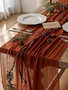 the table is set with place settings and silverware