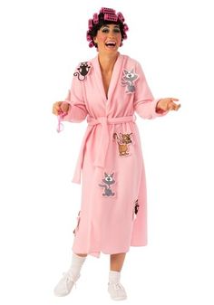 a woman in a pink bathrobe is standing with her hands out to the side