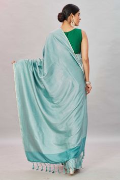 Look your ethnic best on special occasions in this green zari stripes Muga Banarasi saree. The saree comes with a pink blouse piece. Disclaimer: The shown stitched blouse on the model is for display purpose only. The saree comes with a matching blouse piece and finished with fall and piko. Unstitched Pista Green Cotton Silk Pre-draped Saree, Green Cotton Silk Blouse Piece With Dupatta, Green Semi-stitched Pre-draped Saree In Slub Silk, Semi-stitched Green Pre-draped Saree In Slub Silk, Green Semi-stitched Slub Silk Pre-draped Saree, Unstitched Green Slub Silk Blouse Piece, Green Cotton Silk Blouse With Zari Weaving, Green Handloom Pre-draped Saree In Traditional Drape, Designer Handloom Pre-draped Green Saree