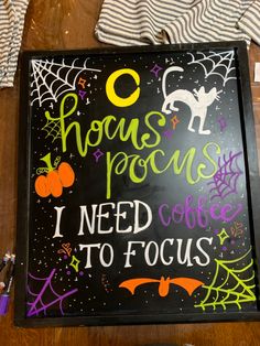 a chalk board with writing on it that says hocps pocus i need coffee to focus