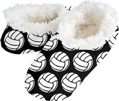 a pair of black and white slippers with volleyball balls on them