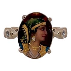 This is part of Chairish’s Fine Jewelry assortment.  Enamel Faced Portrait of Athena Ring 14K  This ring has a beautiful face of Athena a Roman goddess.  This started life as a Stick pin but I couldn't help myself I had to turn this into a ring.  The face is beautiful with a tiny Diamond on her ear.  The band is set with ten 0.10 point Diamonds circling the band. Colors are beautiful it weighs in at 6.09 grams and is a size 5 3/4. This ring is perfect for those with smaller fingers or it can be Artistic Style Rings, Oval Diamond Ring For Collectors, Oval Diamond Ring For Collectible, Unique Collectible Diamond Rings, Roman Goddess, Three Rings, Circle Diamond, Tie Pin, Tiny Diamond