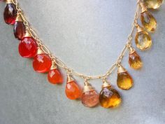 THE JEWELRY IS SHIPPED via DHL EXPRESS (2-5 days delivery door to door). THE DHL SHIPPING COST IS INCLUDED IN THE PRICE. The Sunset Necklace - Solid Gold 14K Multi Gemstone Orange Red Drop Necklace, Semi Precious Colorful Necklace ► Measurements / Details: - Necklace Length: Made to Order - Gold: High quality Gold Filled - Silver: High quality Sterling Silver ► Gemstones: The necklace includes excellent AAA quality precious gemstones: ~ Scapolite ~ Lemon Quartz ~ Citrine in several shades ~ Hone Orange Gemstone Drop Jewelry, Orange Drop Gemstone Jewelry, Gold Drop Necklace With Gemstone Accents, Gold Multi-stone Drop Gemstones, Fine Jewelry Orange Necklaces For Anniversary, Multicolor Citrine Gemstone Jewelry, Orange Jewelry With 17 Jewels As A Gift, Orange Citrine Gemstone Necklace, Citrine Gemstone Briolette Necklaces