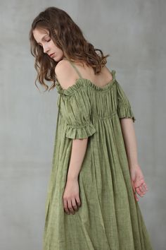 "This linen dress is full of contradictions, ensuring an eye-catching finish. The classic flared structure is contrasted by a slip design, whilst the ruffled details are given a contemporary twist with their asymmetric placement. In a moss green hue, this flared gown is here to turn heads at every event it attends. Off you go. 【Fabric】 95% linen, 5% silk it is Italian linen. exquisite high end texture. we add 5% silk to make it soft and exquisite. lightweight but a little sheer. looks gorgeous. Elegant Green Linen Summer Dress, Elegant Green Summer Linen Dress, Green Linen Bohemian Dress, Summer Off-shoulder Linen Dress, Green Bohemian Linen Dress, Green Flowy Linen Dress, Linen Casual Dress Fantasylinen, Bohemian Green Linen Dress, Flowy Green Linen Dress