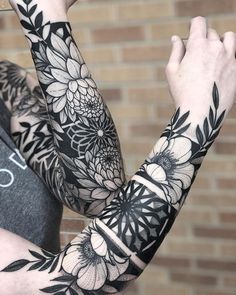 a person with some tattoos on their arms