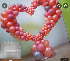 a heart shaped balloon decoration on a table