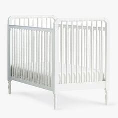 a white crib is shown against a white background with the bottom half turned down